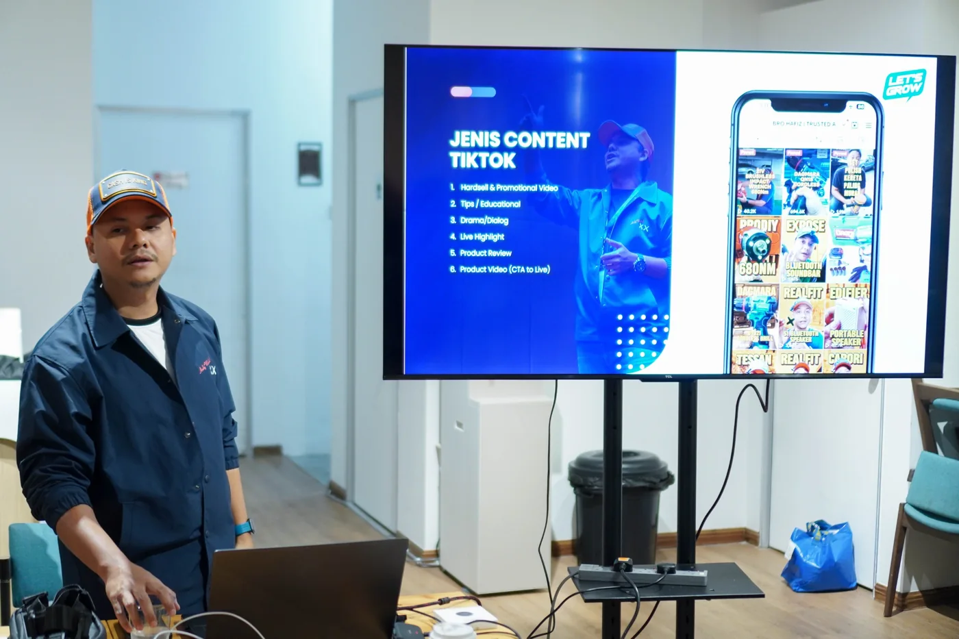 Bro Hafiz teaching TikTok content beside a presentation screen